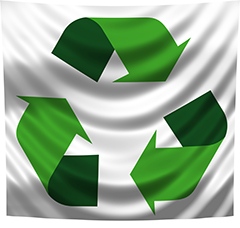 Återvinningssymbol i form av tre gröna pilar. Foto: MRR-photography